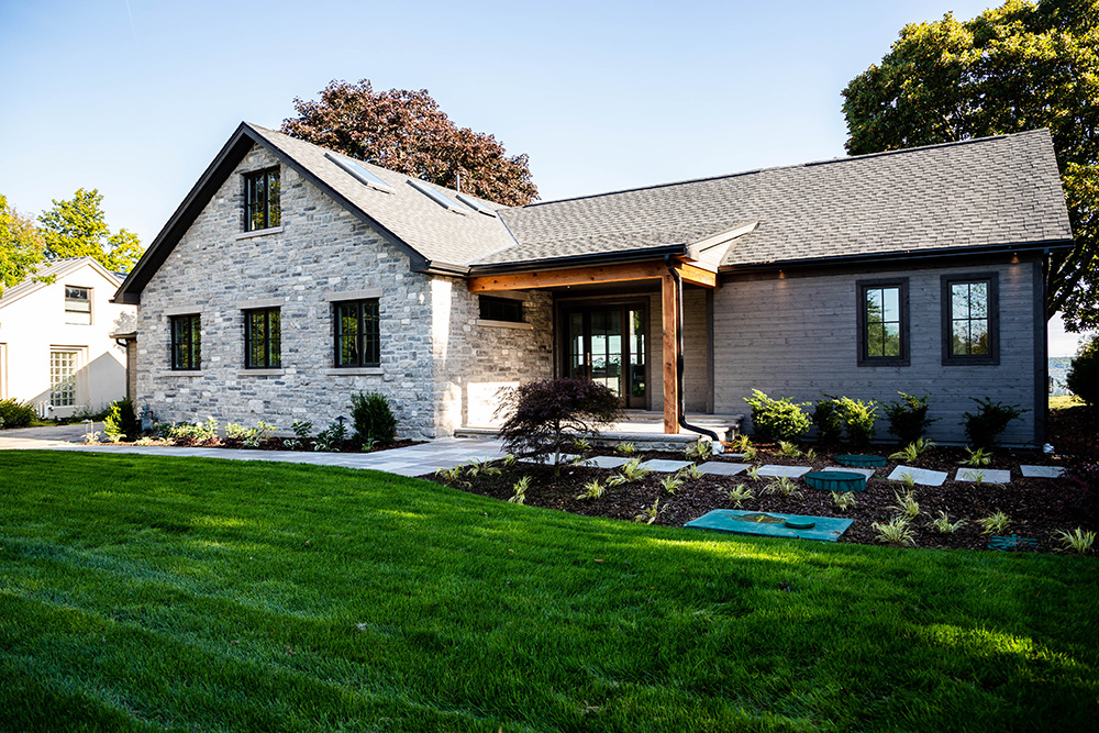An elegant grey brick home serviced by Heartwood Renovations in Dundas, Ontario.